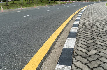 Asphalt road with yellow line