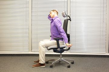 white collar worker male relaxing neck - short break for exercise in office