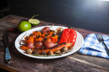 stewed and grilled  food in red bowl: radish, tomato, pepper, chili, onion, garlic, carrot, peas, rosemary, red currant