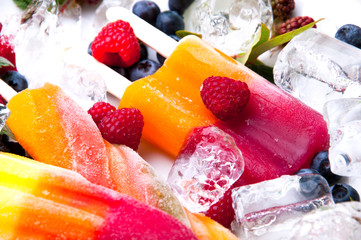 Composition of delicious ice cream, fruits and ice cubes