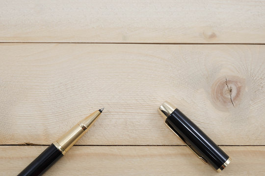 pen on wooden background