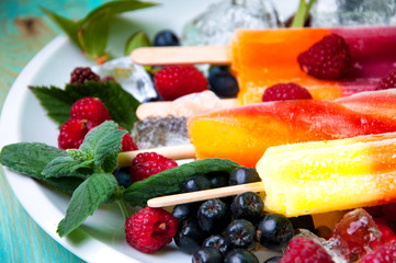 Composition of delicious ice cream, fruits and ice cubes