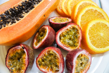 Tropical exotic fruit plate on wooden background