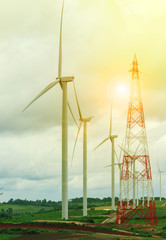 Fototapeta na wymiar wind mill turbine in electric generating farm land