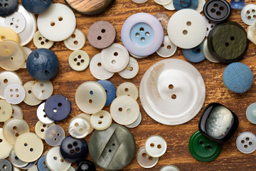 Set of vintage buttons on old wooden table