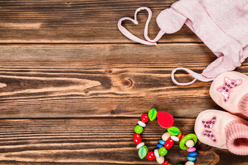 Baby clothes on wooden background