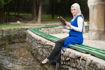 Young Muslim Girl Reading The Koran