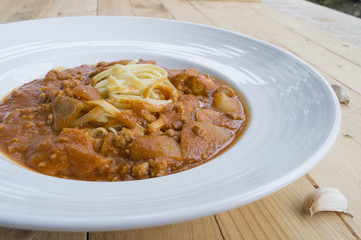 fresh homecook spaghett on wooden table