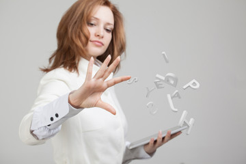 Woman working with a set of letters, writing concept.