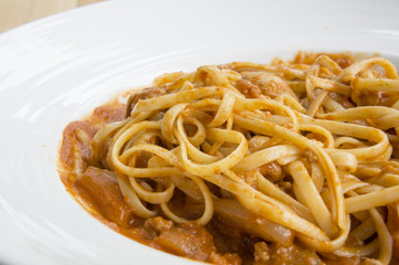 fresh homecook spaghett on wooden table