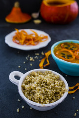 Quinoa grains and pumpkin soup, vegetarian food