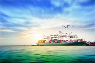 Container Cargo ship and Cargo plane with working crane bridge in seaport , logistic import export background and transport industry.