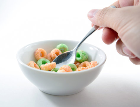 Spoon Scooping Colored O-shaped Sugary Cereal