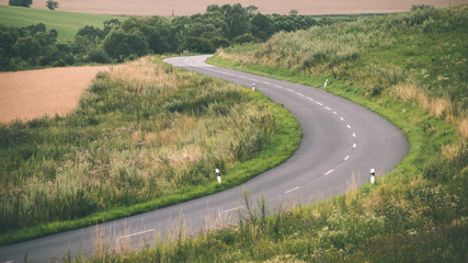 mountain country road in summer - vintage film effect