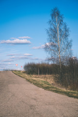 simple country road in summer - vintage film effect