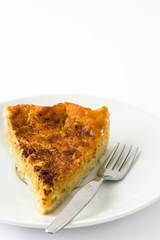 Homemade pumpkin pie on a plate isolated on white background

