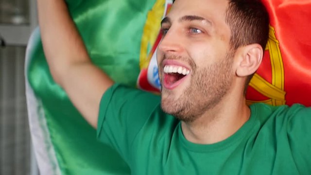 Portuguese Guy Celebrating in Flag - in Slow Motion