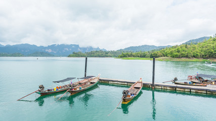 Fototapeta na wymiar Boats are docked at the marina in Ratchaprapha dam, Surat Thani,