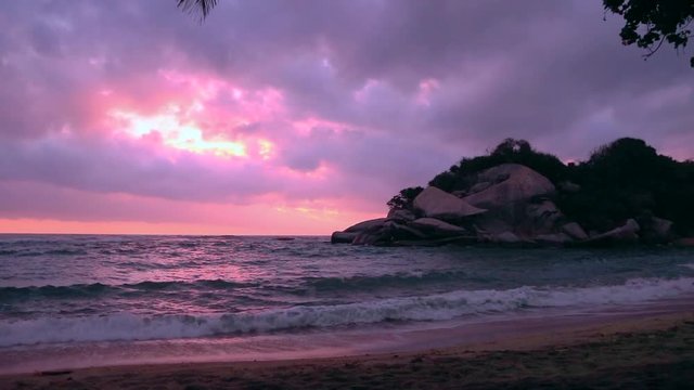 Purple sunset on a paradisiac beach  - Cabo San Juan, Tayrona National Park, Colombia