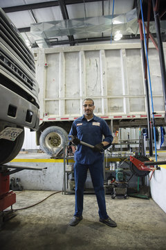 Middle Eastern mechanic in repair shop