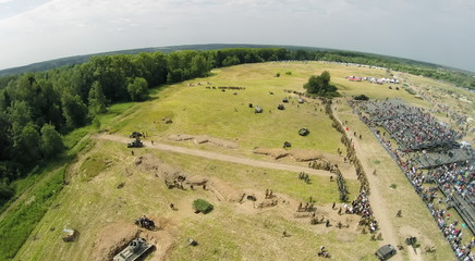Filed with soldiers formation and tribune with spectators during reconstruction Battlefield at...