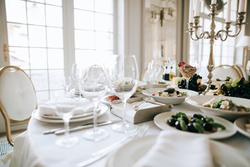 catering table set service with food and drink at restaurant before wedding party