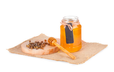 Jar of honey and  honey dipper