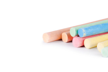 Colorful chalk on a white background.