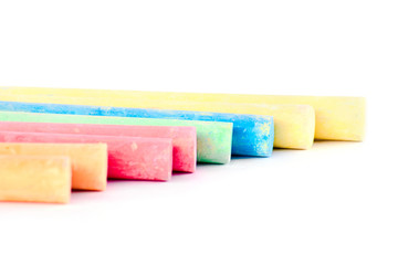 Colorful chalk on a white background.