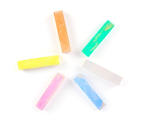 Colorful chalk on a white background.