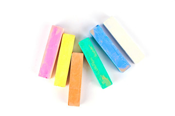 Colorful chalk on a white background.