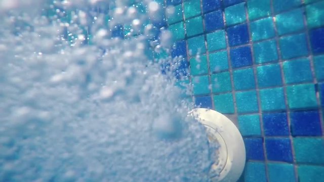 underwater bubbles from pool water jet filling hose, thermal spa 