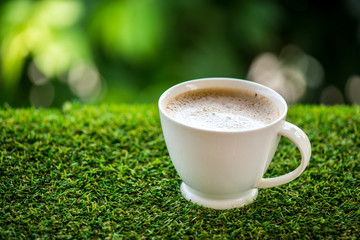 coffee cup on grass floor
