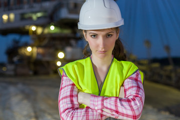 female worker closeup on rails on backgroud of career stacker