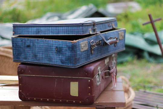 two old worn suitcases