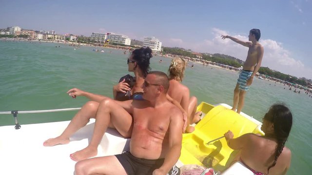 People enjoy summer time on pedal boat ride