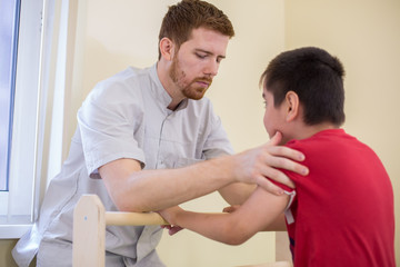 Doctor supports the child during treatment