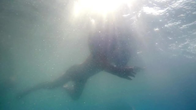 Underwater clip of todler child swimming SLOW MOTION