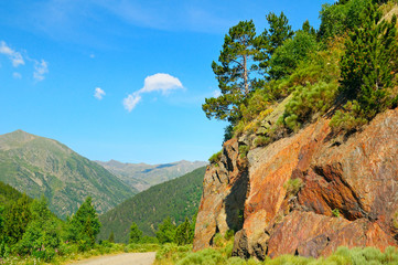 Scenic mountain landscape with cliff and pines