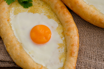 Open pie with egg and cheese