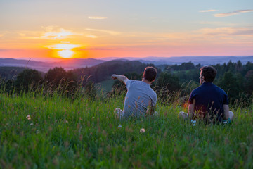 Two friends watching sunset in Czech Republic stock photo