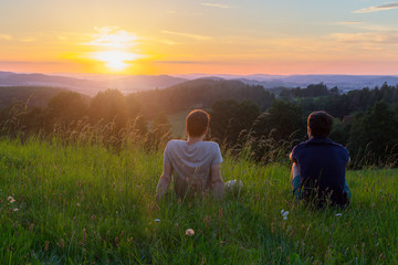 Two friends watching sunset in Czech Republic stock photo