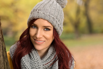 Smiling girl with scarf and cap