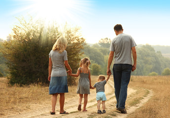 young family walk together