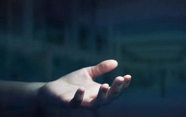 Businesswoman hand on black dark background
