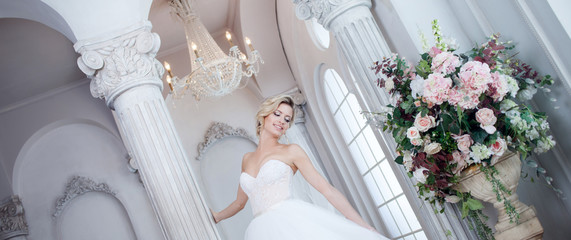 Charming young bride in luxurious wedding dress. Pretty girl, the photo Studio