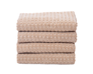 Organic cotton folded bath towels separated on white background