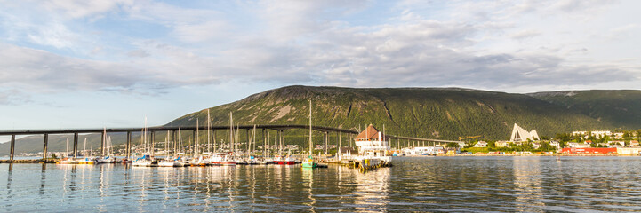 Fototapeta premium Skyline with the harbor, bridge and arctic cathedral of Tromso i