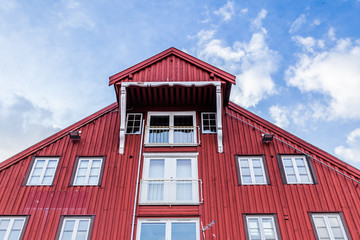 Old wooden warehouses along the harbor in the center of Tromso in northern Norway
