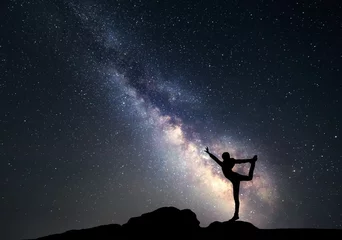 Foto auf Acrylglas Milky Way. Night sky with stars and silhouette of a sporty woman © den-belitsky
